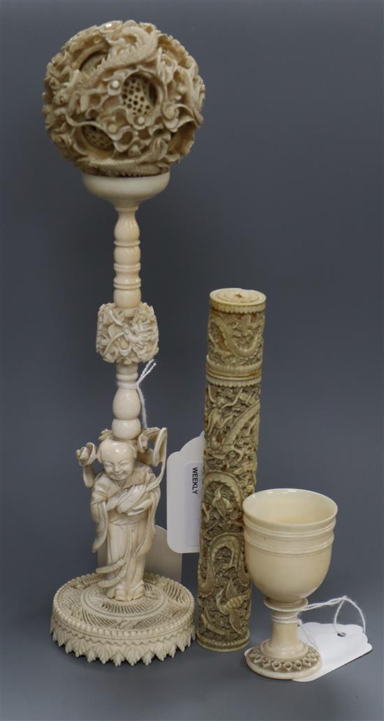 A Chinese carved ivory concentric ball on stand supported by a Buddha with lotus and two other ivory items,